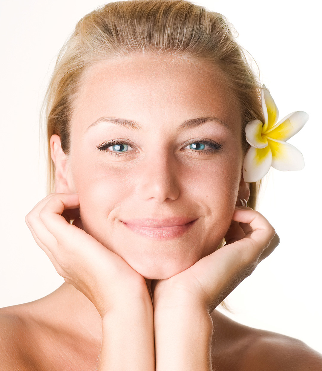 A young woman's face, showing flawless skin.