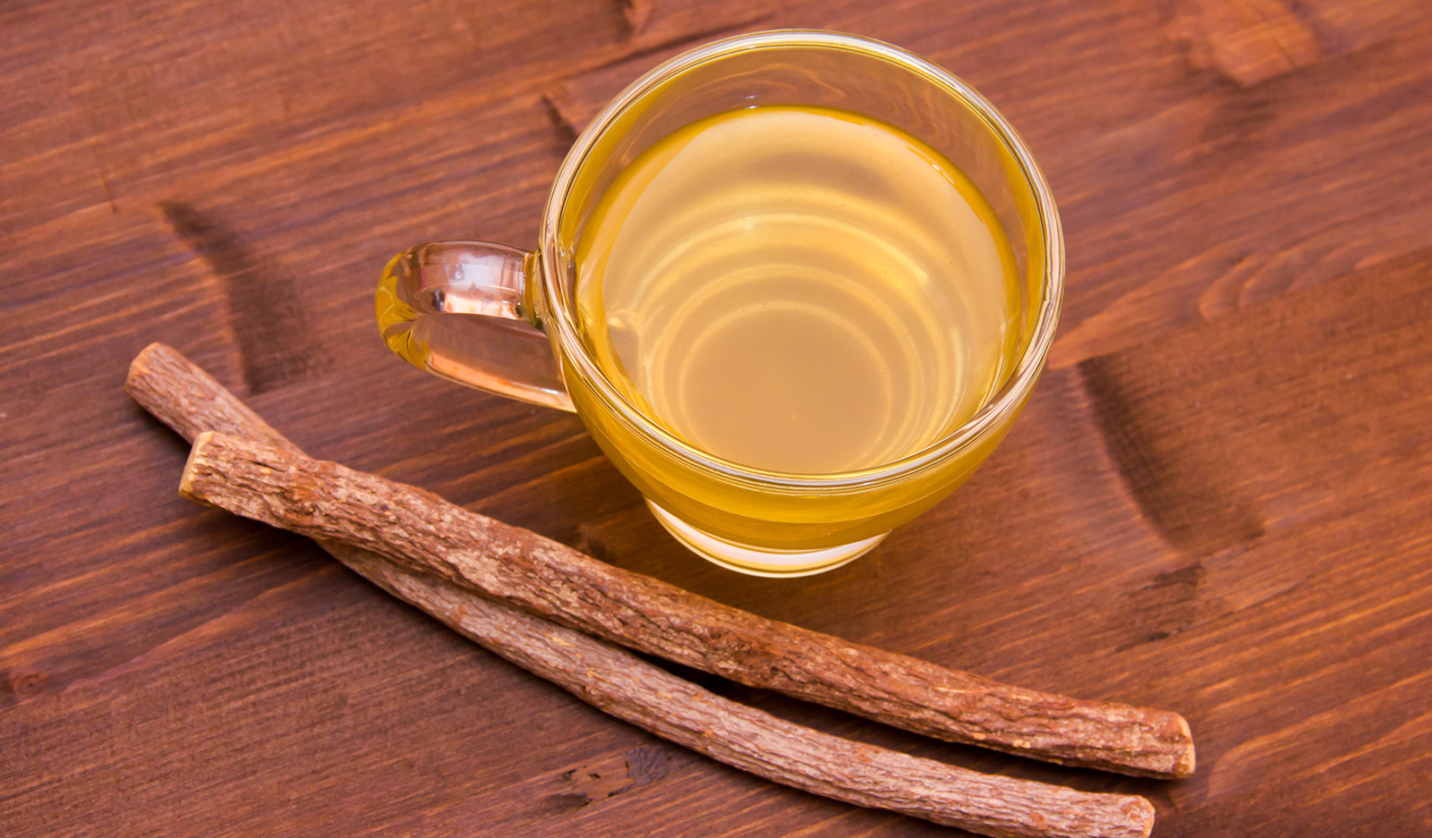 A cup of licorice tea in a glass