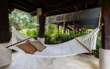 hammock with pillows hung in room